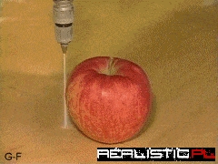 Water Jet Cutting an Apple in Half
