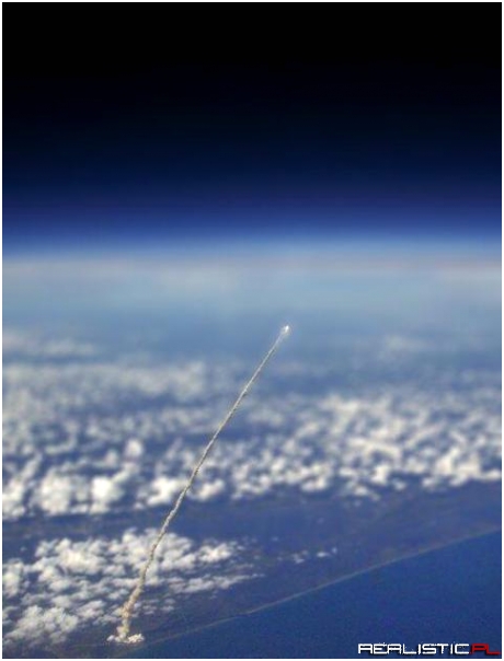 Space Shuttle launch viewed from a plane