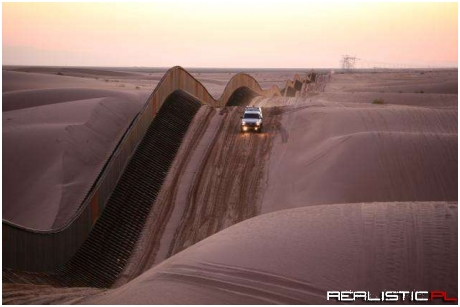 Algodones Sand Dunes Curvy Border Fence in Southern California