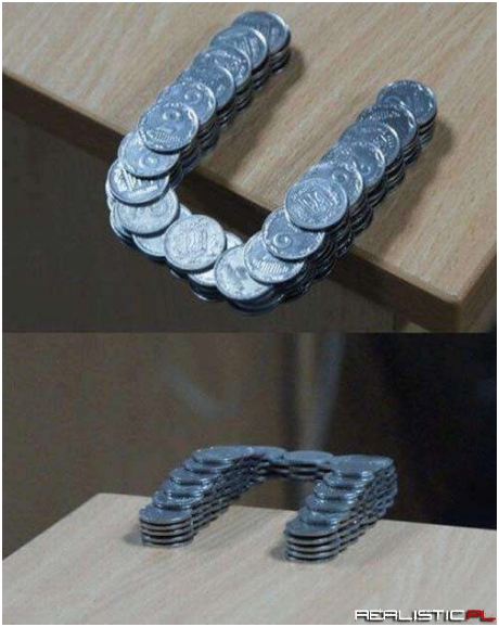 Coins Stacked in Such a Way That They Extend Past the Edge of the Table